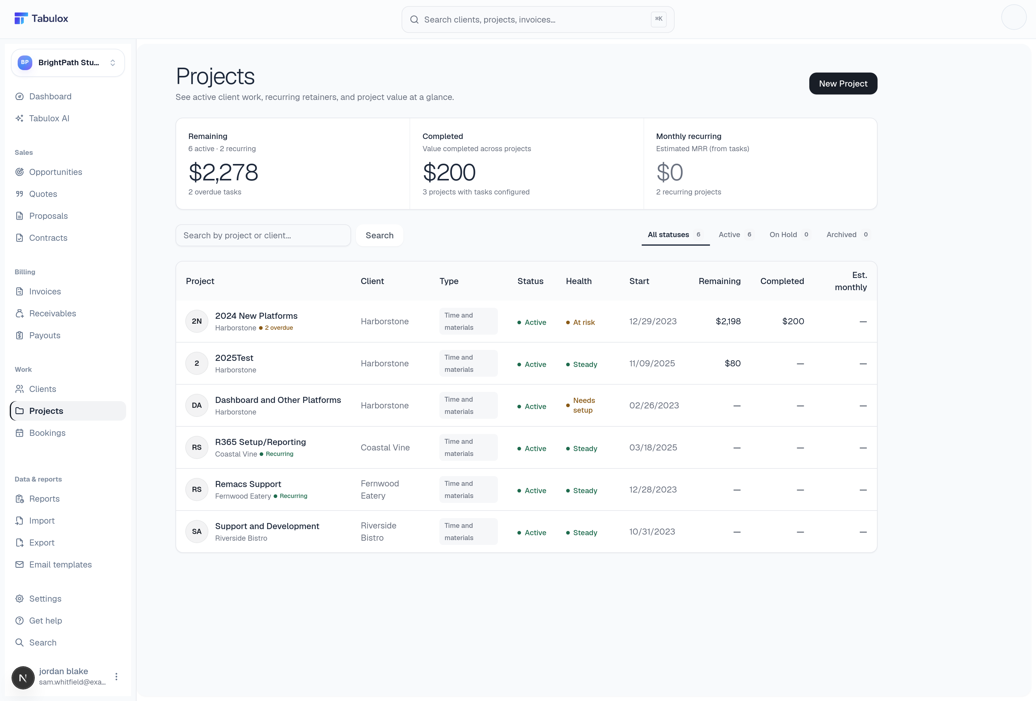 Tabulox projects list showing remaining/completed/recurring value cards and a project table with health status